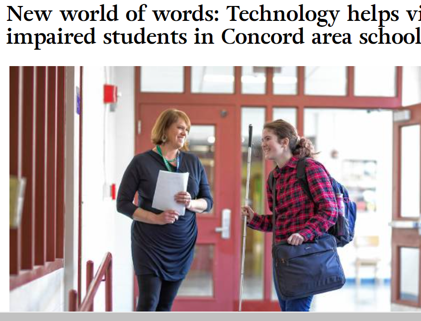Abby holding her white cane in her right hand, wearing a computer bag and backpack, smiling at her teacher in school.  